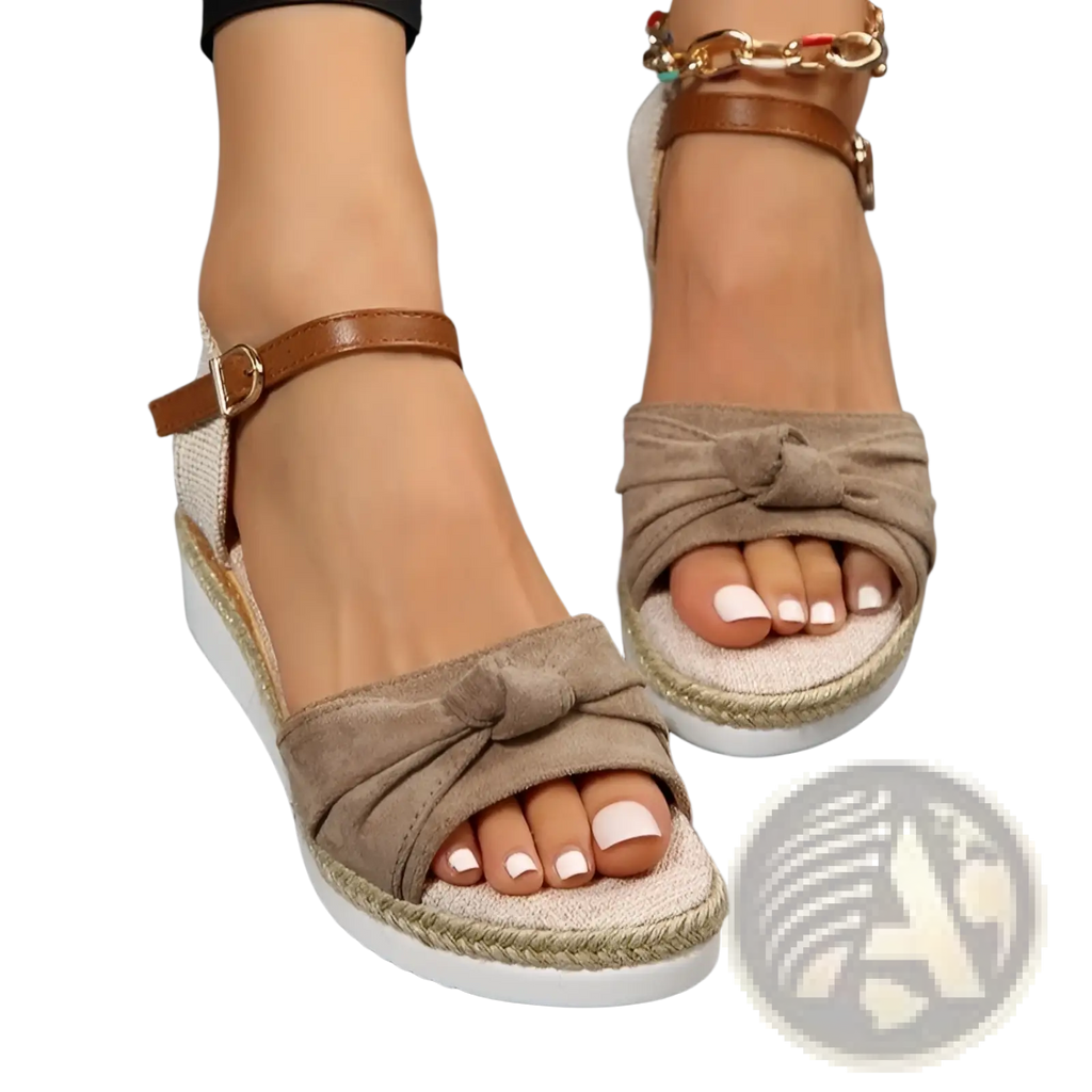 Beige suede bow wedge sandals with knotted strap detail and woven espadrille rope sole with buckle strap