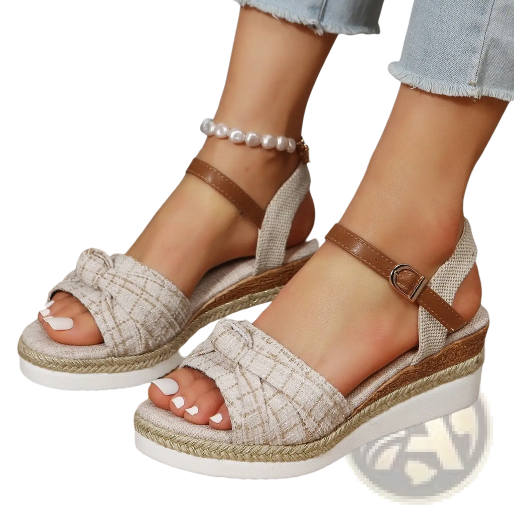 Beige bow wedge sandals with woven rope sole brown leather buckle strap and decorative front bow detail