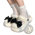 White platform clog shoes with black satin bows designed as bowknot slip-on rubber sandals for casual wear