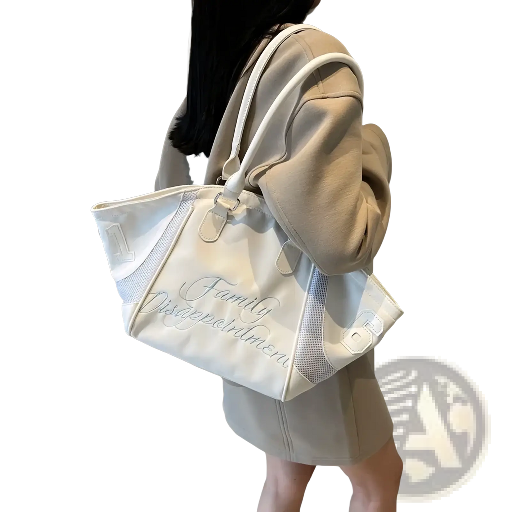 A white bowling bag embroidered sports tote handbag with mesh side panels and silver family disappointment script