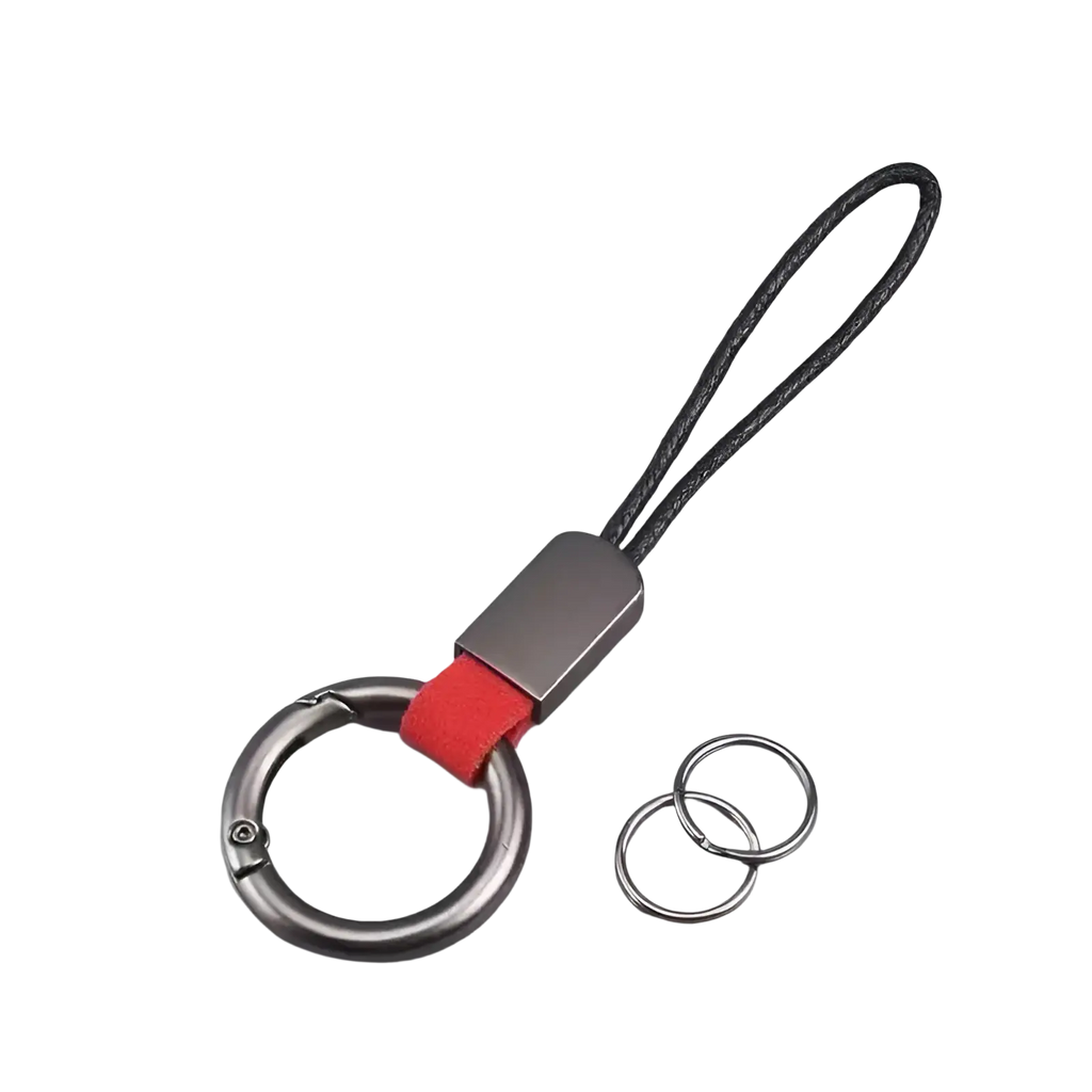 Silver-toned braided leather car keychain with textured black cord, red fabric accent, and metallic carabiner clip
