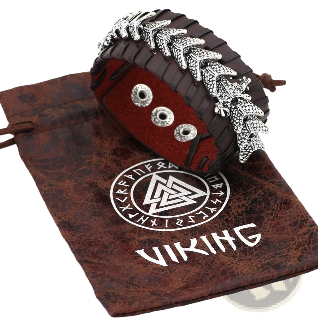 Dark brown braided leather viking dragon head bracelet with intricate silver dragon motifs and three silver rivets
