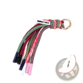 Bimba y lola braided tassel keychain bag charm with colorful neon green pink and black patterned braided cords