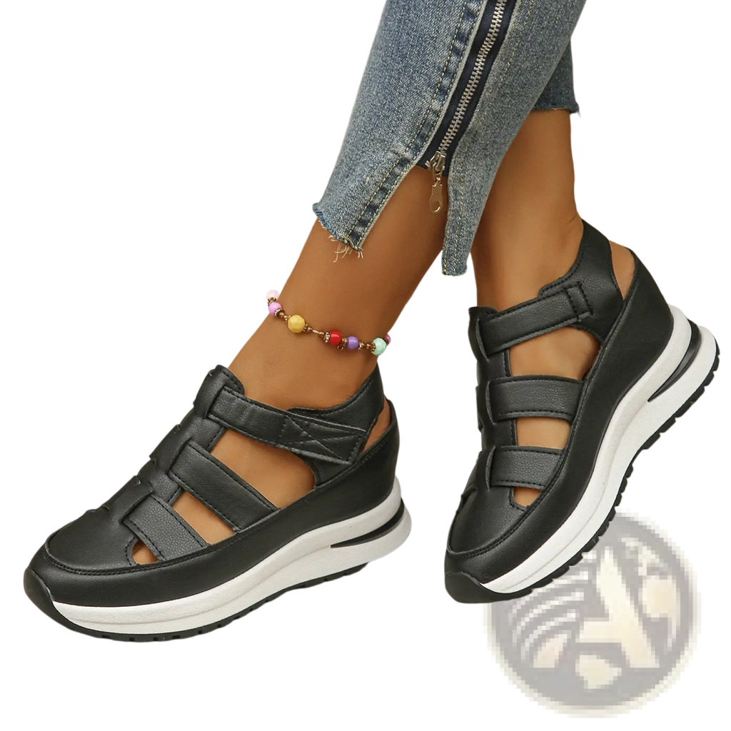 Black breathable hollow wedge platform sandals with multiple velcro strap closures and a white rubber sole