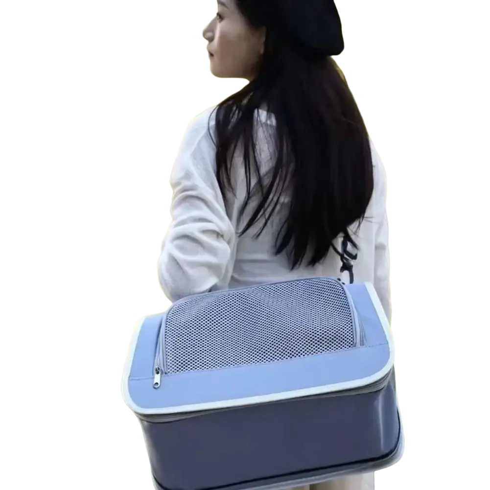 Light blue and gray breathable mesh pet carrier shoulder bag with a mesh top panel for ventilation
