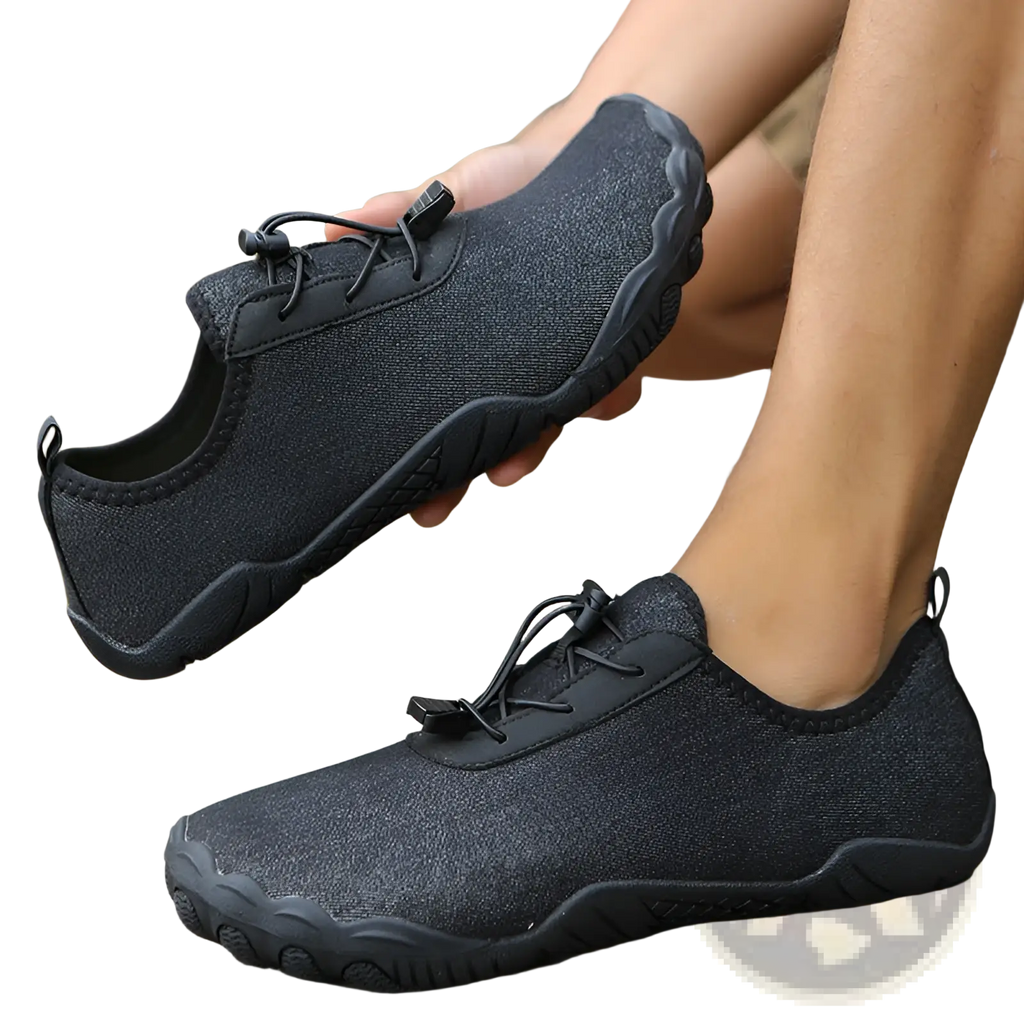 Black breathable non slip mesh water shoe with textured upper and rubber sole for beach and trekking use