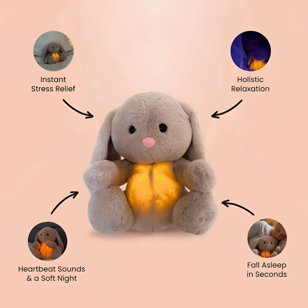 A plush gray breathing rabbit soothing sensory baby toy with a glowing yellow belly for stress relief