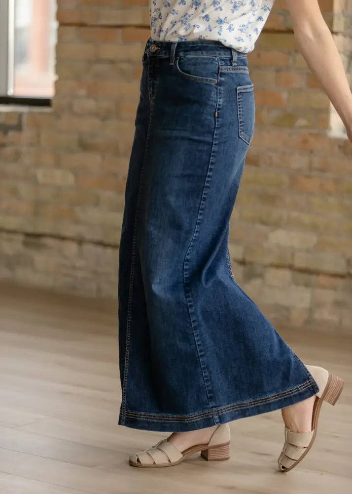 Bria dark wash denim maxi skirt with a straight cut and side slit in dark blue denim material