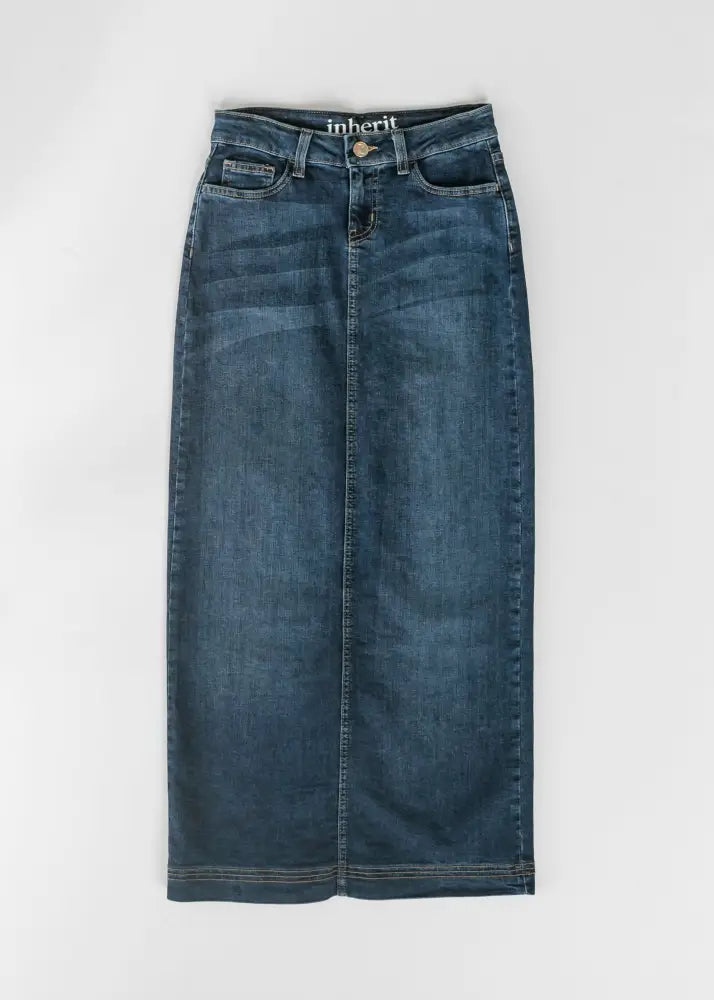 Bria dark wash denim maxi skirt with side slit featuring dark blue fabric and inheri brand label at the waistband