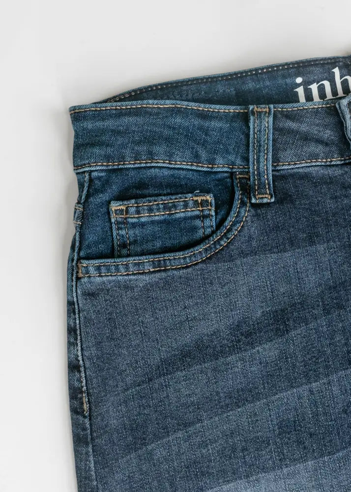 Bria dark wash denim maxi skirt with side slit in dark blue denim featuring classic five-pocket design and visible stitching