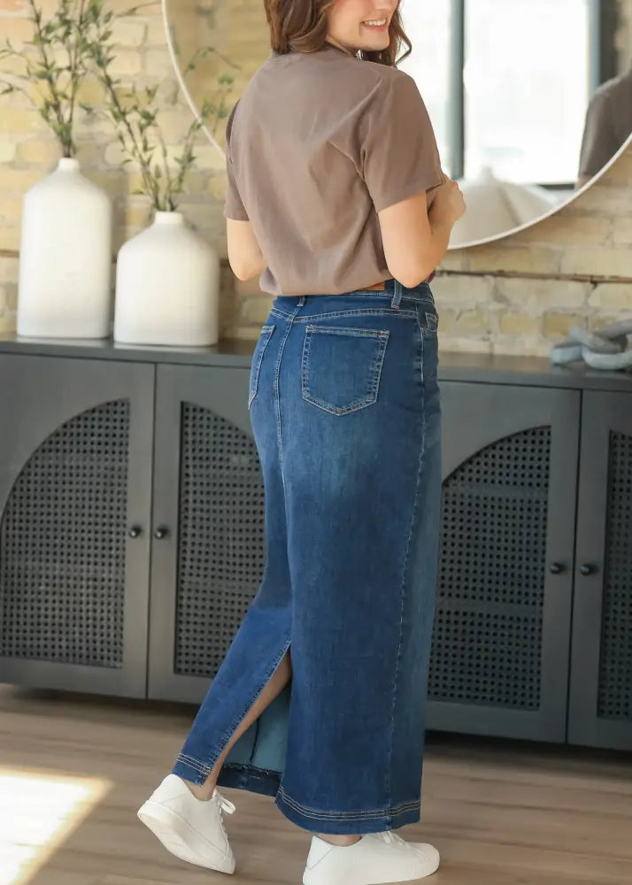 Bria dark wash denim maxi skirt in blue with side slit and classic stitching details
