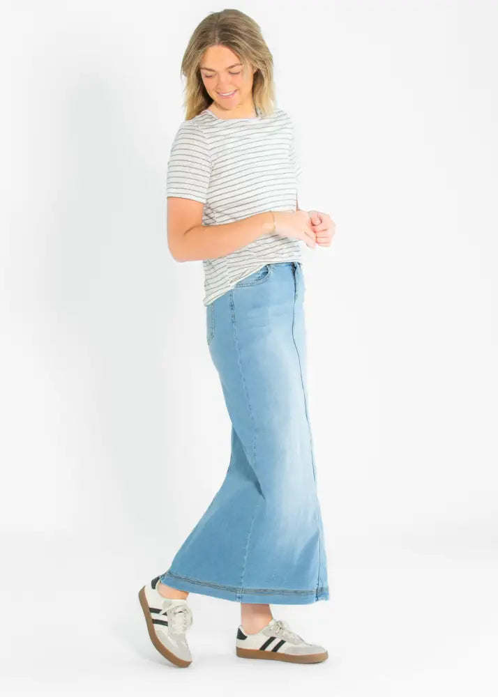 Bria light wash sustainable denim maxi skirt in light-wash with a flared silhouette and subtle fading at the hem