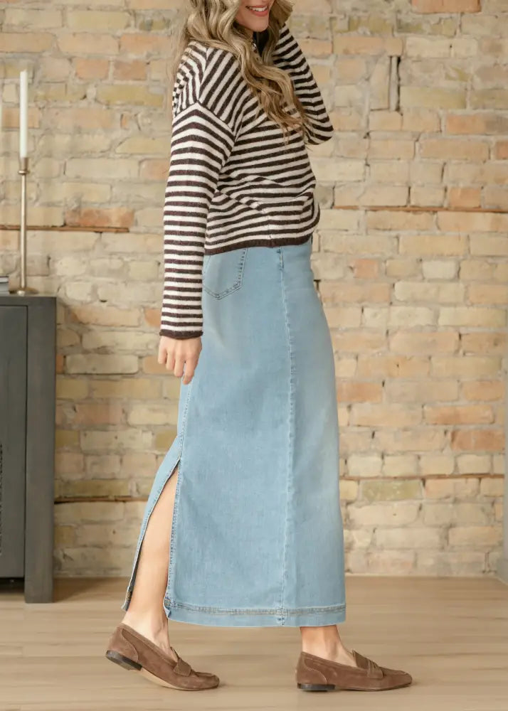 Bria light wash sustainable denim midi skirt in light blue with a side slit for stylish casual wear