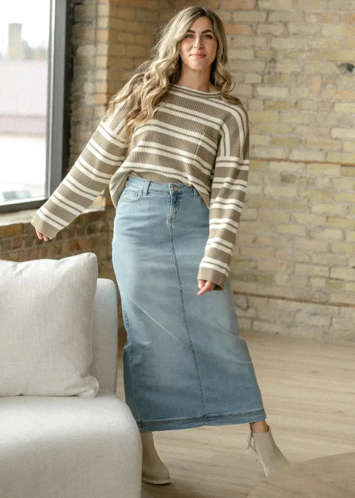 Bria light wash sustainable denim skirt with a mid-thigh length straight cut and visible front seam
