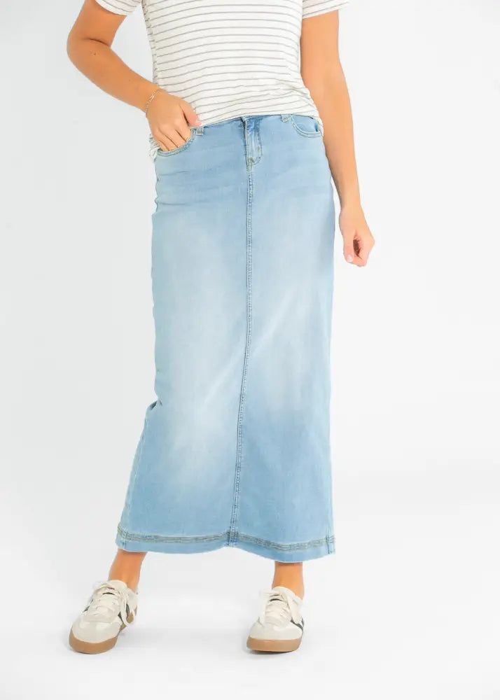 Bria light wash sustainable denim maxi skirt with a straight cut and subtle fading along the hem