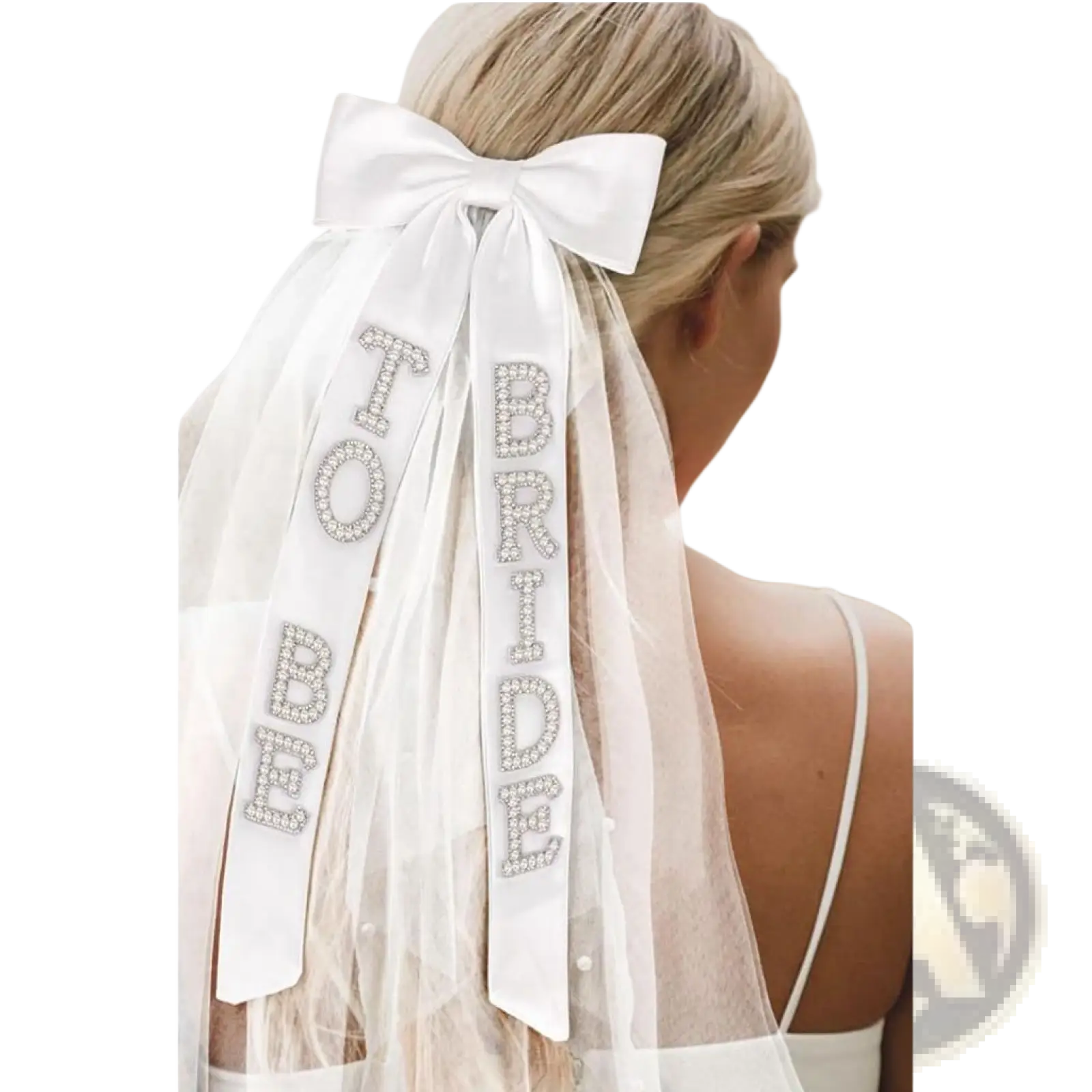 A delicate white bridal bow veil with satin bow and rhinestone bride to be lettering on sheer ribbons