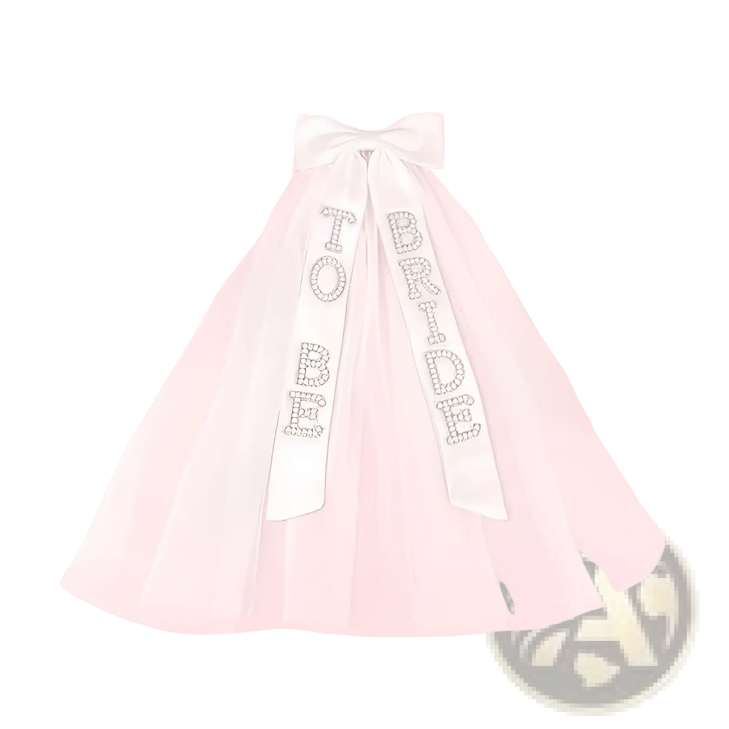 A delicate white tulle bridal bow veil with a sparkling bride to be rhinestone-embellished sash