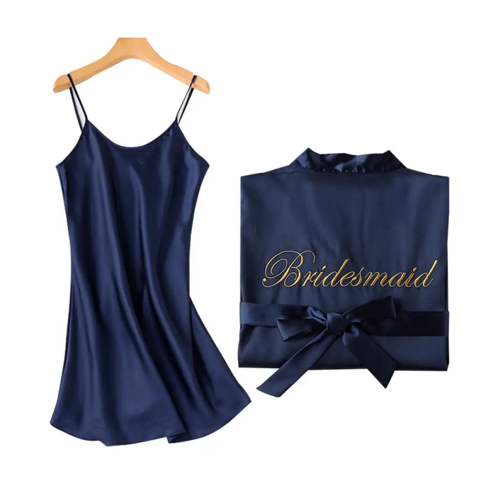 Navy blue satin bridesmaid robe with gold embroidered lettering and matching bow tie from embroidered satin bridal nightgown set