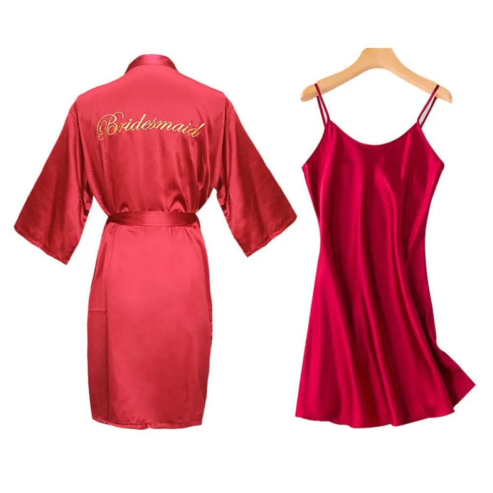 Red satin bridal nightgown and robe set with gold embroidered lettering and matching red silk slip dress