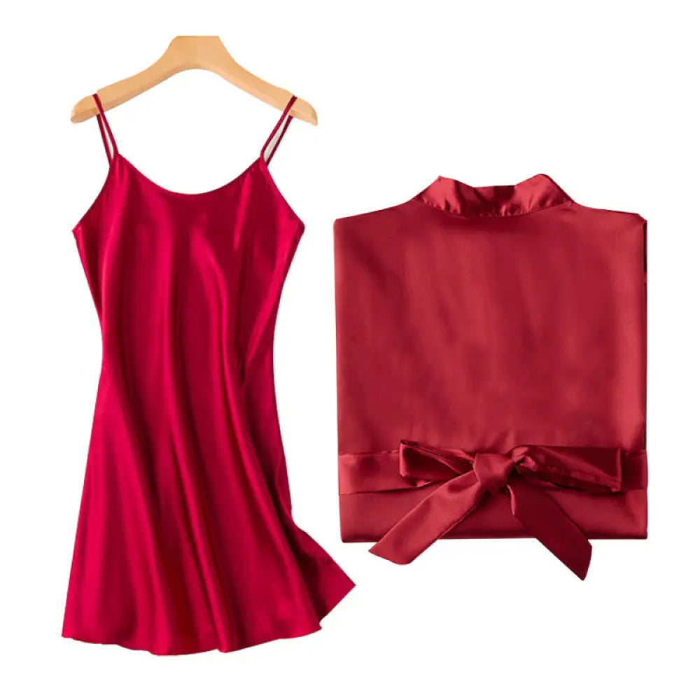 A vibrant red embroidered satin bridal nightgown slip dress with thin straps and matching satin robe tied at the waist