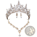 A sparkling gold bridal crown and jewelry set with clear crystal leaf designs and teardrop pendant accents