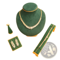Gold-toned leaf-shaped necklace with clear crystals on dark green velvet bust from bridal crystal jewelry set 4-piece wedding accessories