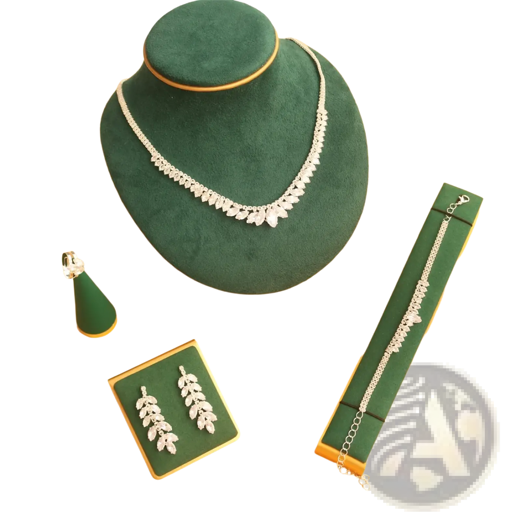 Silver leaf-shaped necklace with sparkling crystals displayed on a green velvet bust from bridal crystal jewelry set