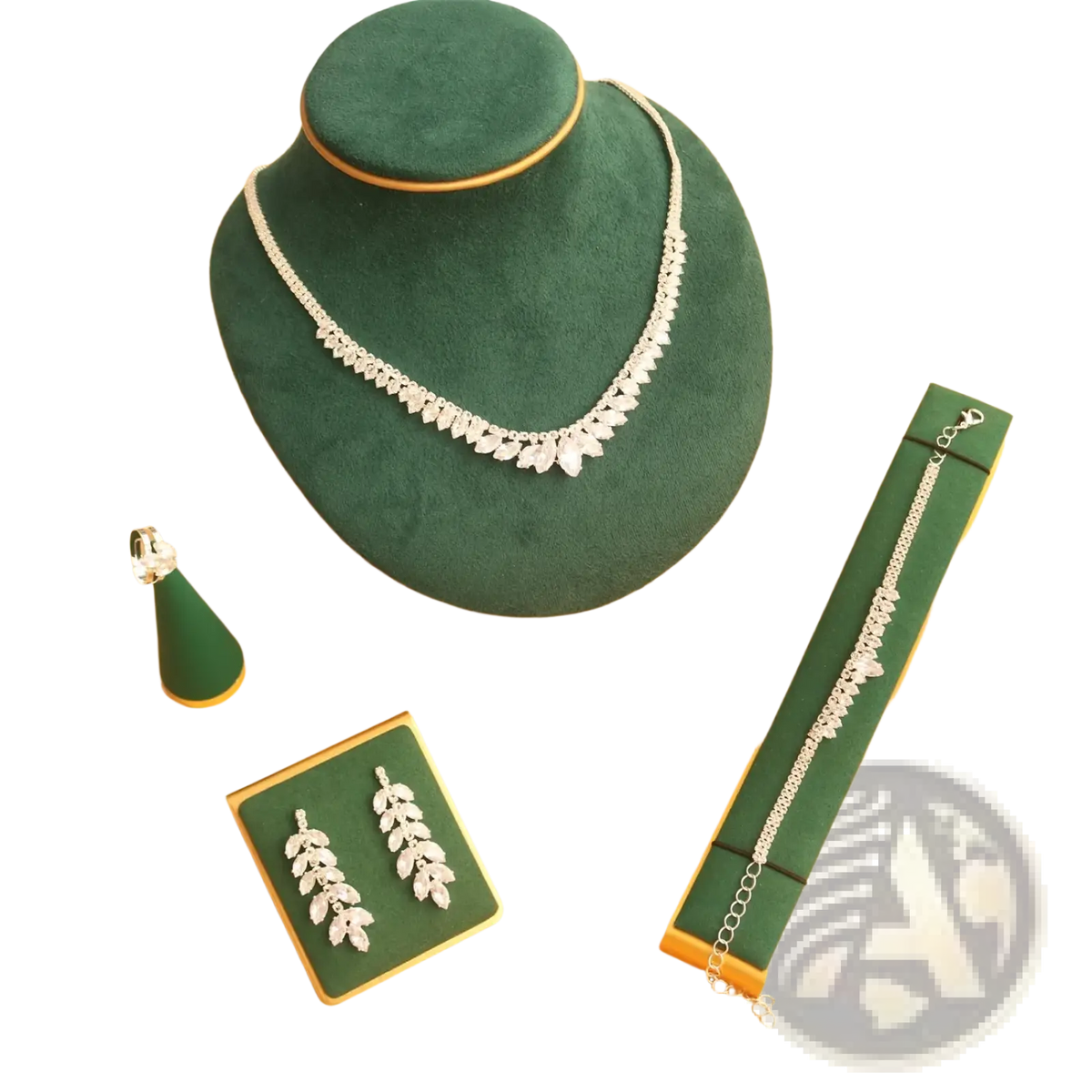 Silver leaf-shaped necklace with sparkling crystals displayed on a green velvet bust from bridal crystal jewelry set