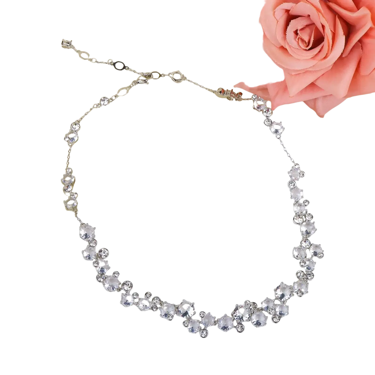 A delicate silver bridal crystal necklace with clear sparkling crystals of varying sizes on a fine chain