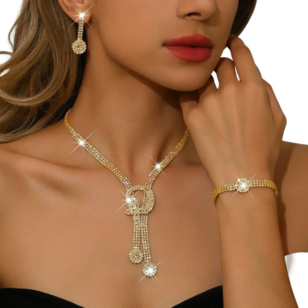 Gold-toned diamond-encrusted bridal necklace with cascading ornate pendant design in diamond jewelry set