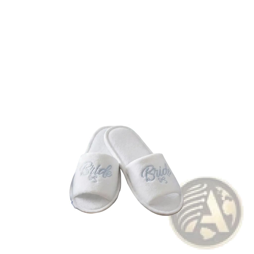 White plush slip-on bridal party slippers embroidered with bride in silver thread for team bride gift set