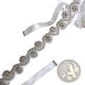 Bridal rhinestone satin sash belt in white satin with intricate silver beading and sparkling crystal embellishments