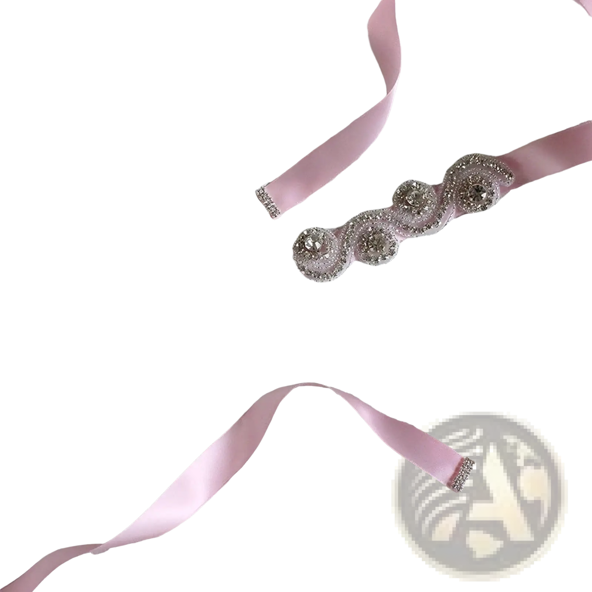Bridal rhinestone satin sash belt featuring a delicate pink satin material with sparkling silver beaded embellishments