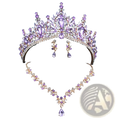 Bridal tiara jewelry set with sparkling purple and gold crown, amethyst stones, clear crystals, necklace, and earrings on black bust