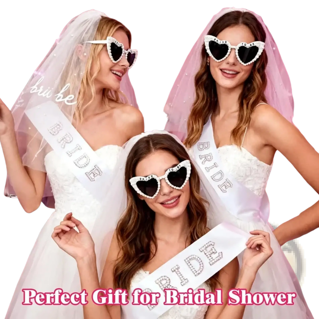 White heart-shaped bride to be sunglasses with black lenses and beaded trim from accessory set with veil and sash