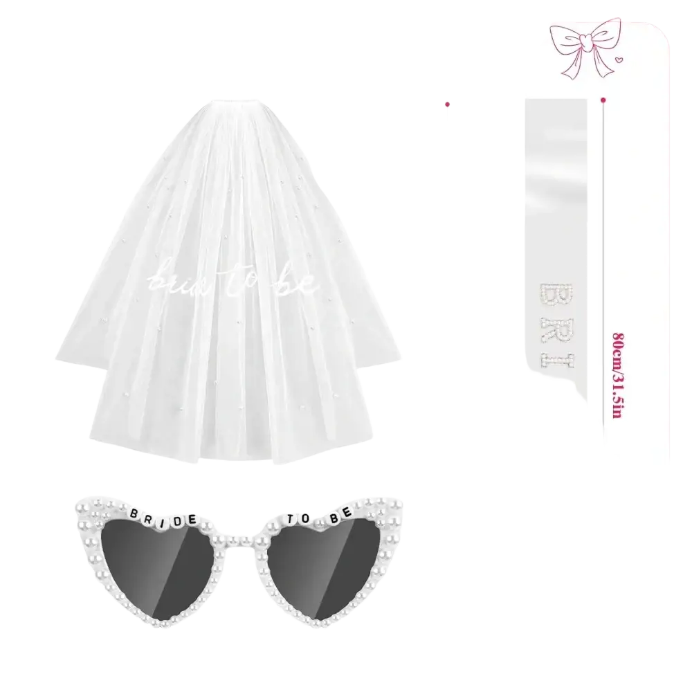 White tulle bridal veil with pearl embellishments and bride to be sash in soft cursive from accessory set