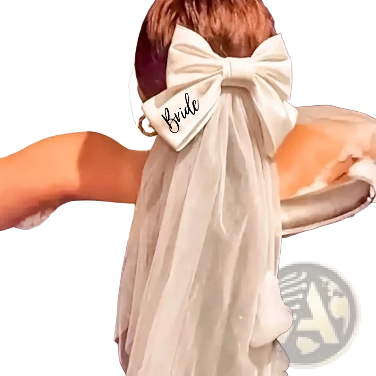 Ivory satin bride bow veil with black embroidered bride script attached to a woman’s hair