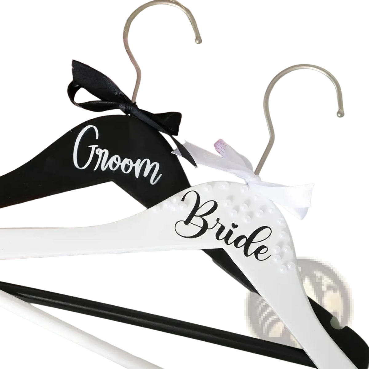 Black and white wooden bride and groom pearl wedding hangers set with black ribbon and white satin bow embellishments