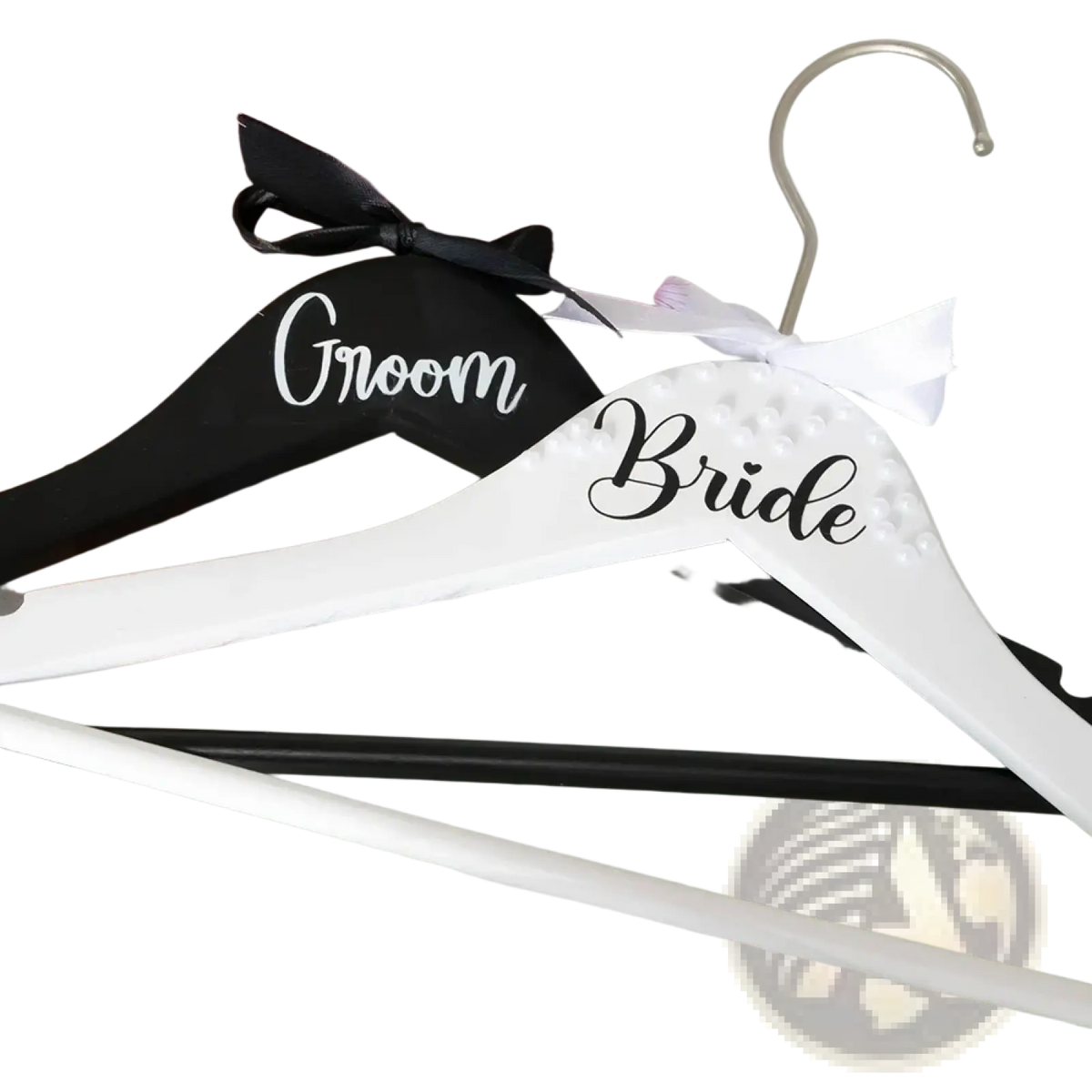 White and black personalized wooden bride and groom wedding hangers with pearl embellishments and ribbon bow