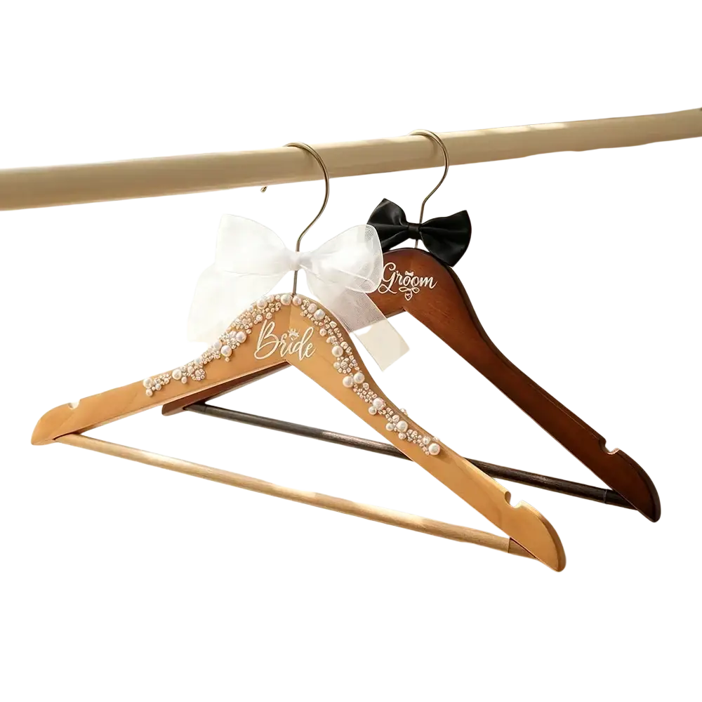 Elegant wooden bride and groom pearl wedding hangers set with white pearl and black bead embellishments and bows