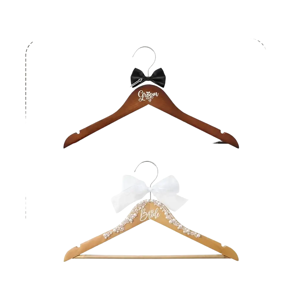 Bride and groom pearl wood wedding hangers set with dark brown wood and engraved silver and gold lettering and bows