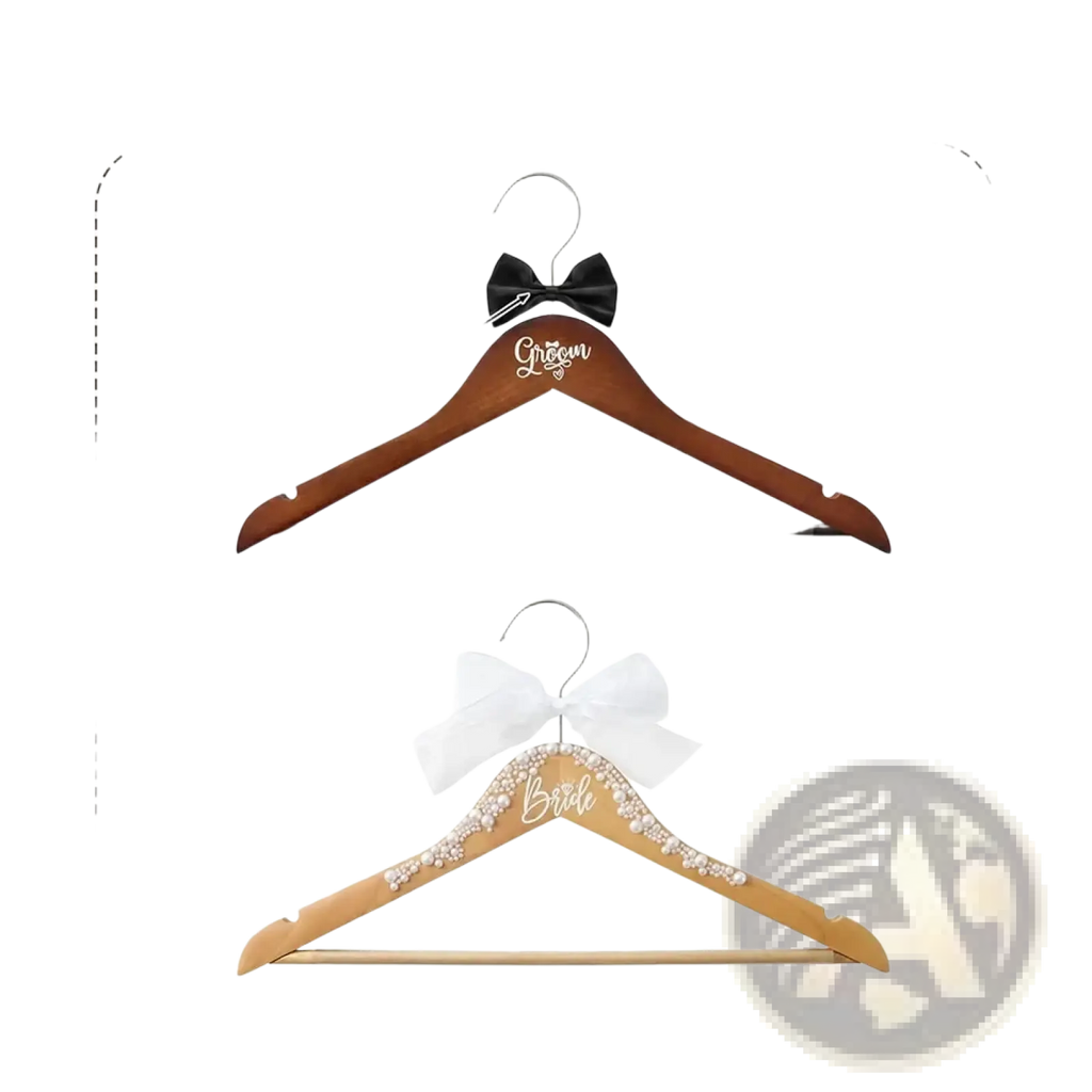 Bride and groom pearl wood wedding hangers set with dark brown wood and engraved silver and gold lettering and bows