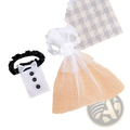White tuxedo-themed hair tie with black ruffled band and three black buttons for bride and groom wine glass cover set