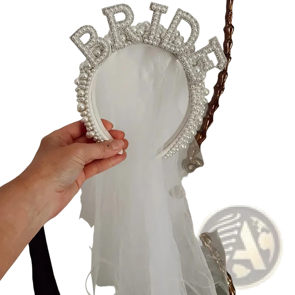A sparkling white bride headband pearl crown adorned with rhinestones and pearls for wedding veils