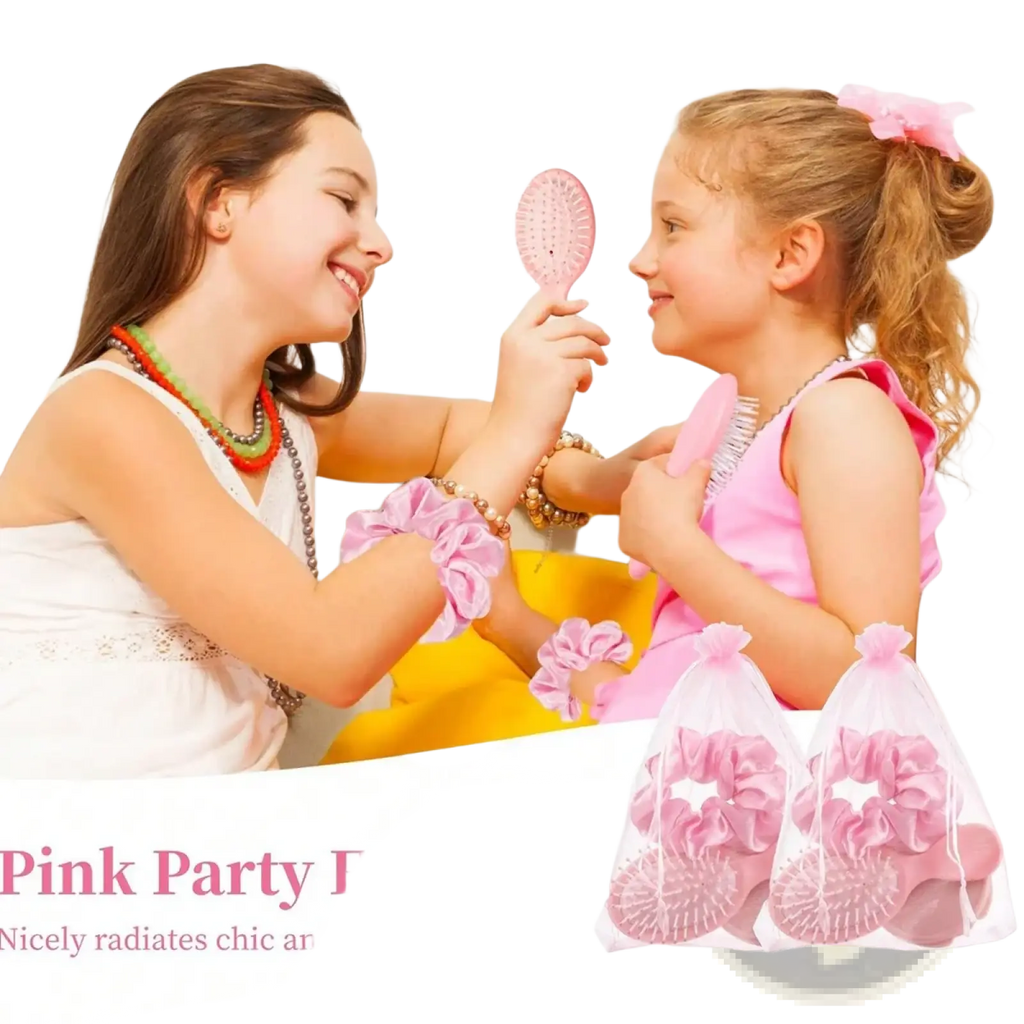 Pink plastic bridesmaid hairbrush with rounded oval head and soft bristles in hairbrush and scrunchie gift set
