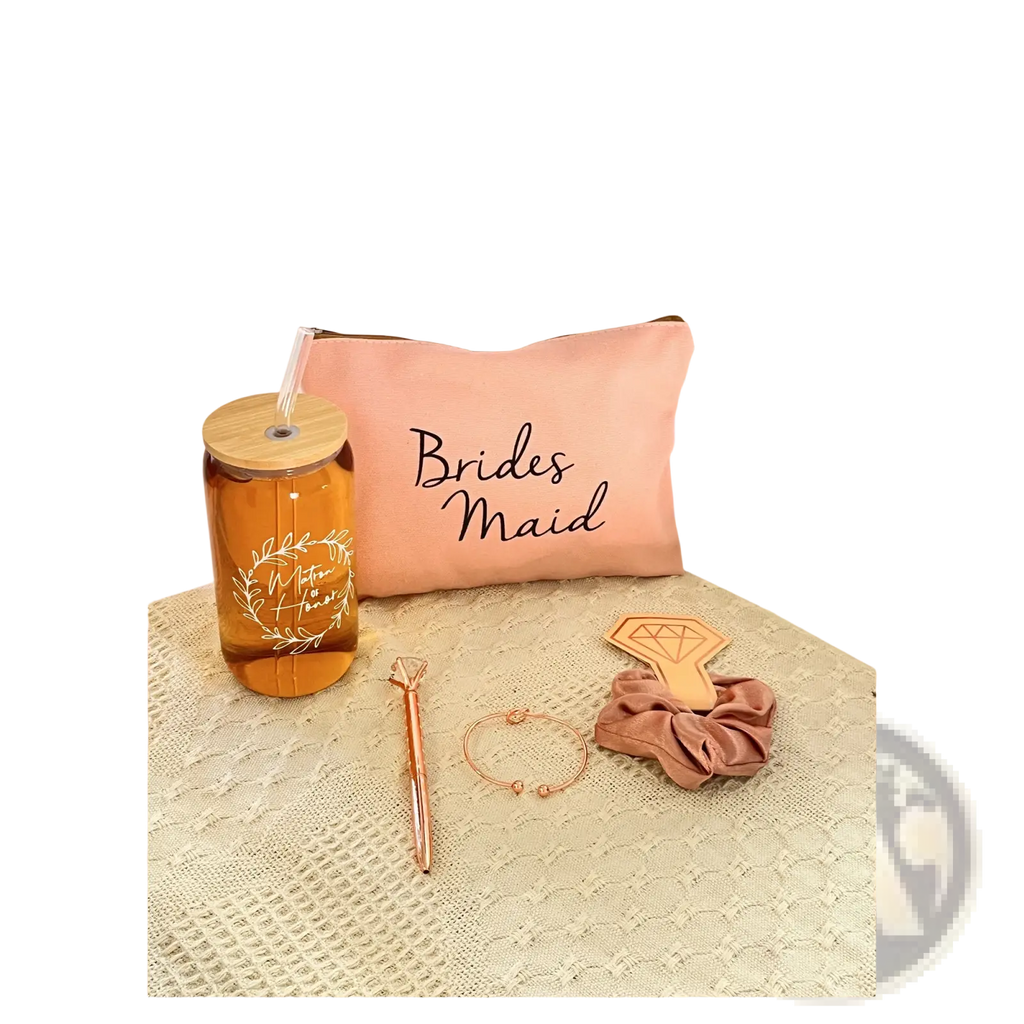 Pink bridesmaid makeup bag made of durable fabric shown as part of bridesmaid proposal gift set with glass cups