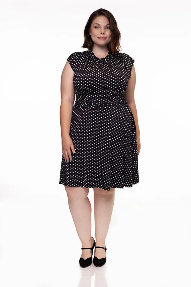 Black polka dot midi dress with ruffled neckline and fitted waist in plus size 4x retro style