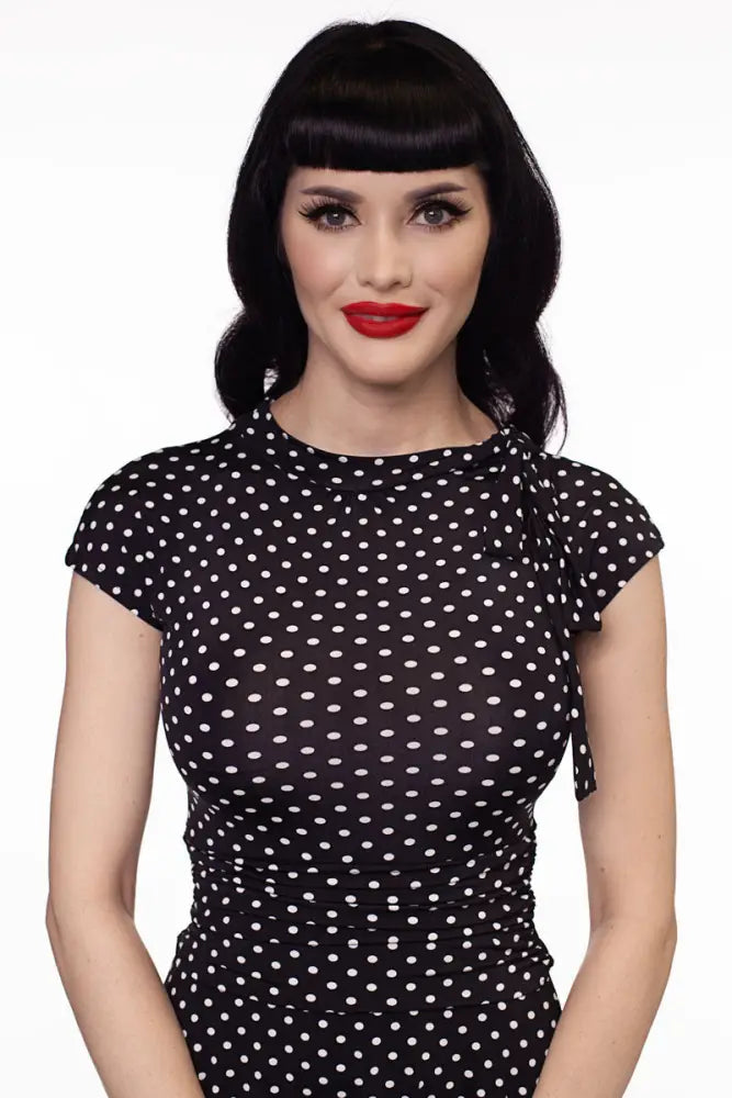 Black and white polka dot retro midi dress with short sleeves and ruched bodice in plus size 4x