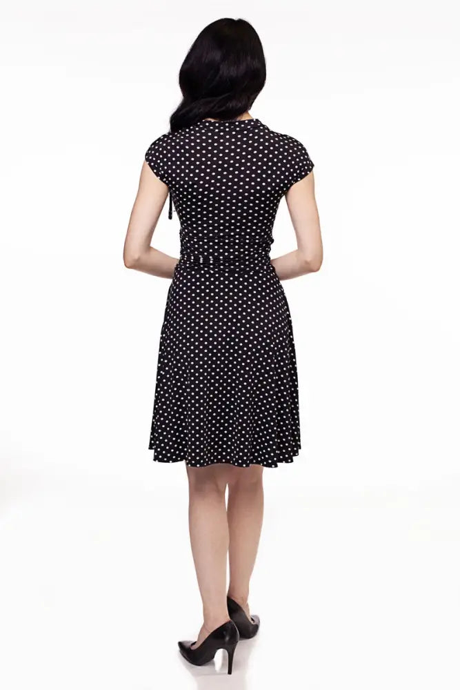 Bridget polka dot retro midi dress in plus size 4x featuring black fabric with white dots and a fitted waistband wrap design