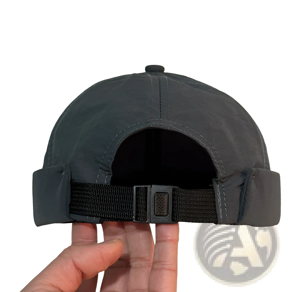 Black brimless quick drying adjustable baseball cap showing back with fabric strap and metal buckle closure